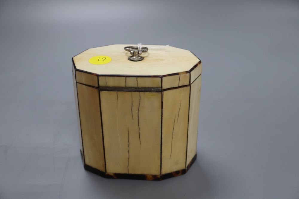 A George III decagonal ivory and tortoiseshell veneered tea caddy, height 10cm
